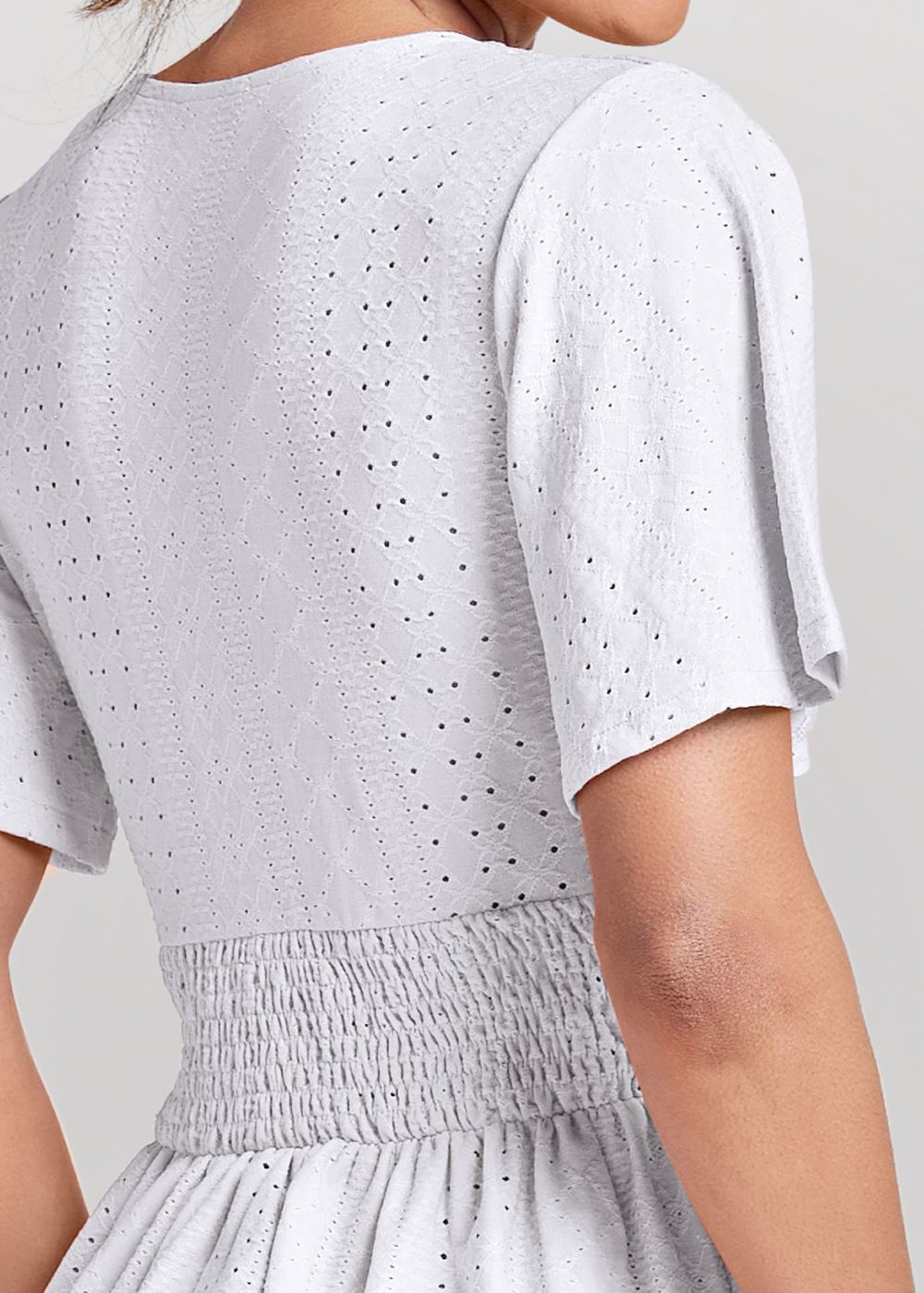 Venus Stretch Eyelet Peplum Top in White